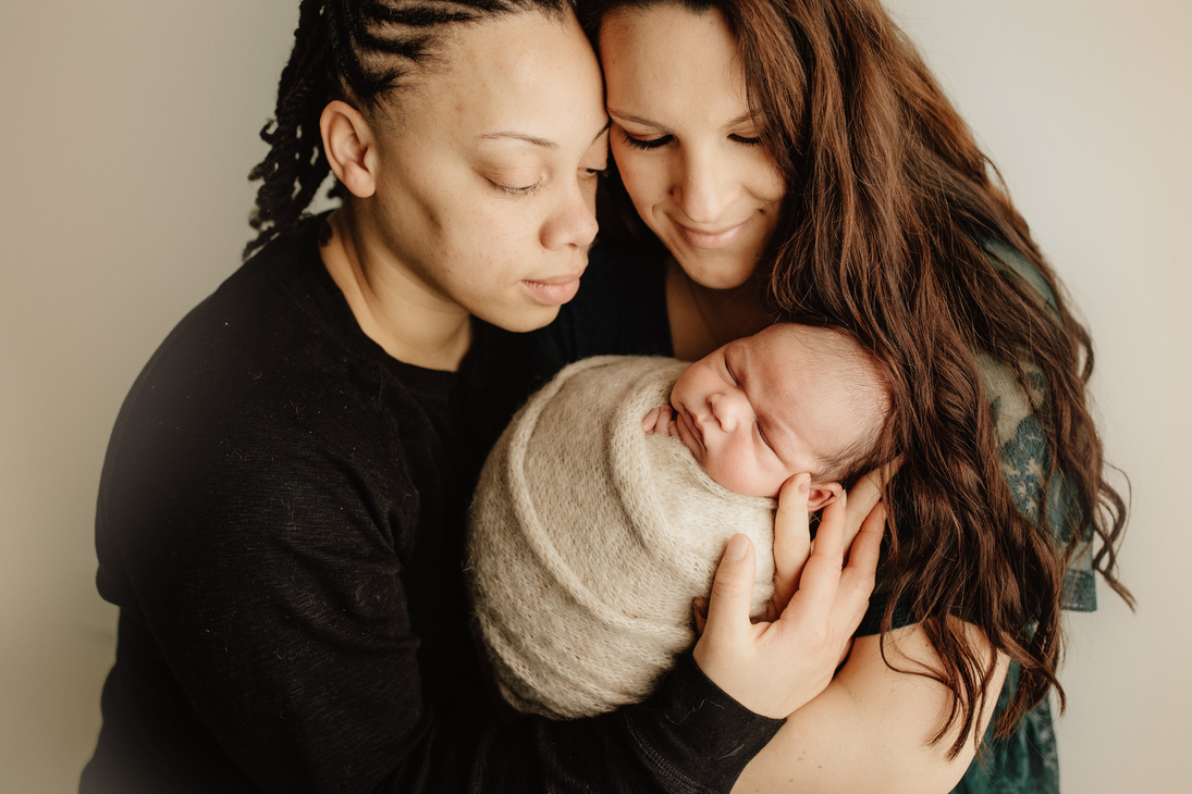 Lesbian Couple Holding Their Baby